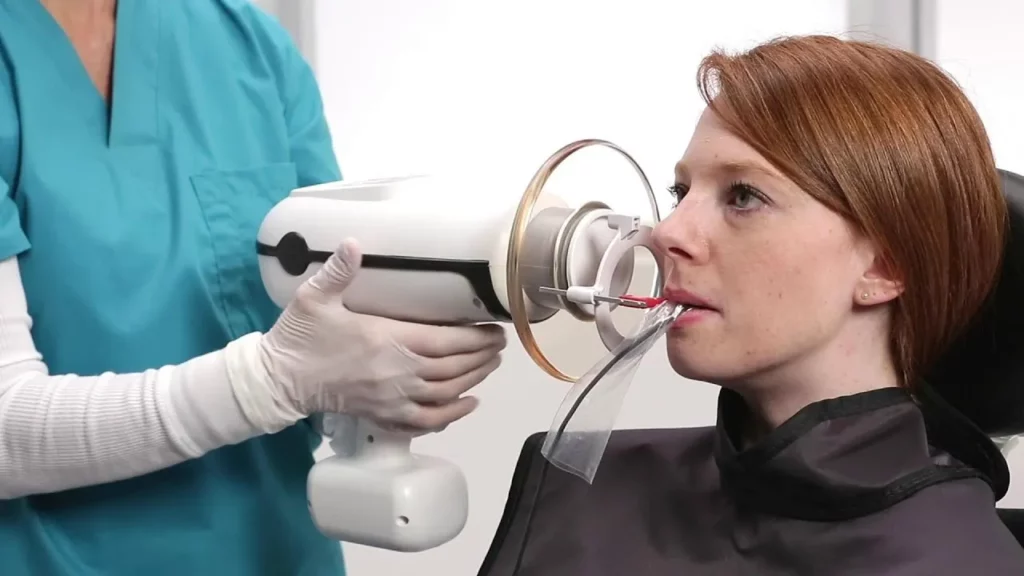 Dental assistant positioning handheld X-ray device for patient | 24th Street Dental in Phoenix, AZ