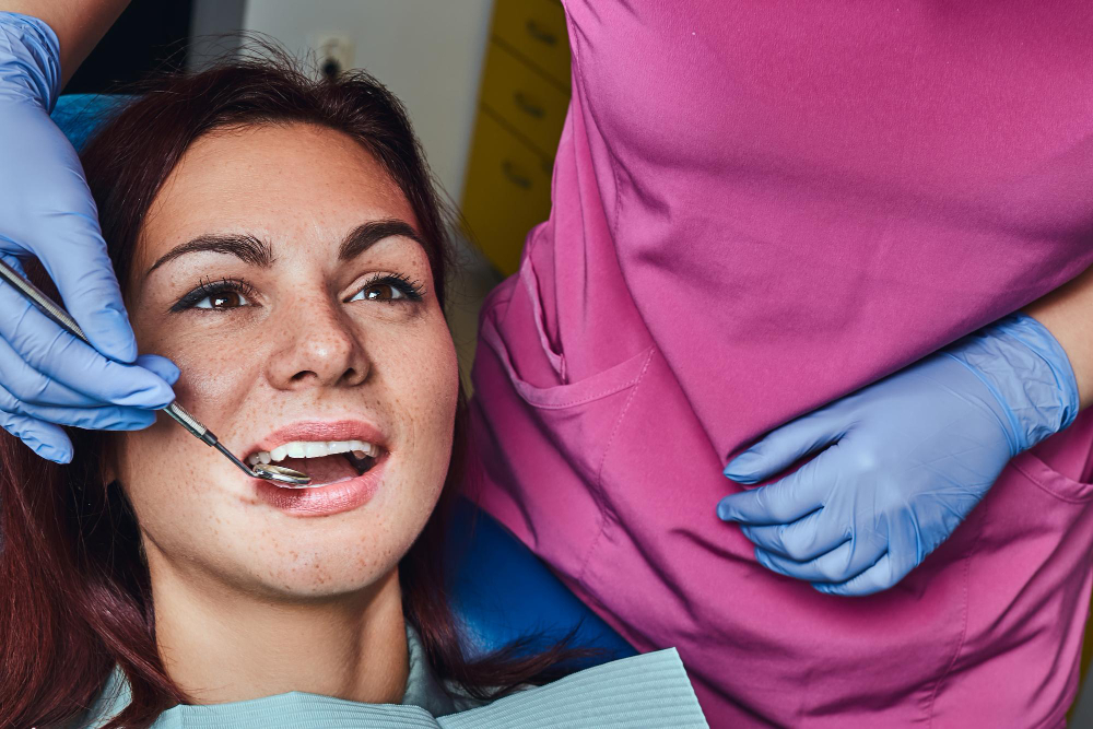 A dental implant being placed in a patient's mouth